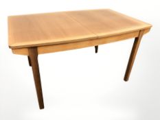 A Nathan teak extending dining table, and set of four chairs,