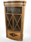 An early 20th century continental mahogany bow front single door cabinet, 87 cm x 44 cm x 159 cm.