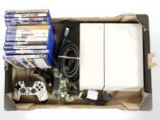 A Playstation 4 console, controllers and various games.