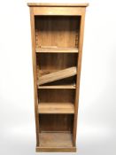 An oak open bookcase with adjustable shelves,
