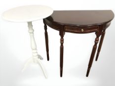 A painted tripod table,