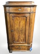 A 19th century continental walnut corner cabinet, height 157 cm.