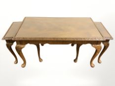 A mahogany nest of tables with plate glass top,