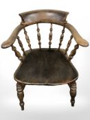 A 19th century elm spindle backed smoker's armchair,