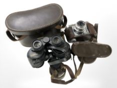 A pair of Wilkinson 10x40 binoculars and a Voigtlander Vito B camera.