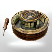 An antique praxinoscope with turned winding handle.