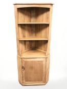 An Ercol elm corner cabinet