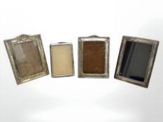 Two hallmarked silver photograph frames, another unmarked but presumed silver, and an EPNS example,