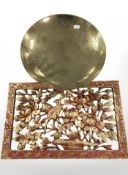 A Chinese engraved brass dish on stand and a further gilded panel.