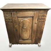 A late 18th century Scandinavian carved oak single door cabinet dated 1791,