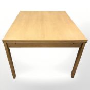 A contemporary Danish oak draw leaf dining table, extended 228 cm x 100 cm x 74 cm.