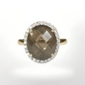 A 9ct yellow gold smokey quartz cluster ring, size M/N. CONDITION REPORT: 3.1g.