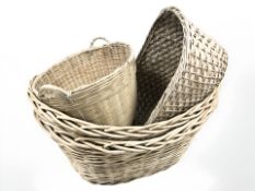 Four various wicker baskets, largest 85 cm wide.