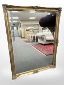 A contemporary gilt framed bevelled over mantle mirror, 106 cm x 137 cm.