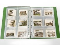 An album containing a quantity of R & J Hill Views of Interest Real Photographs,