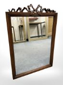A contemporary mahogany mirror with ribbon pediment, 70 cm x 99 cm.