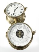 A Schatz brass ships style barometer and a further quartz timepiece.