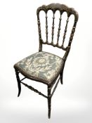 A 19th century ebonised and gilt occasional chair