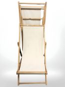 Two pine folding deck chairs