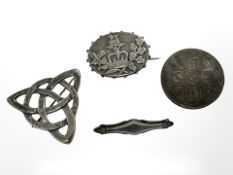 Four silver brooches including examples of enamel, Victorian jubilee, 1887 Crown etc.