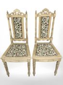 A pair of carved pine occasional chairs in studded floral upholstery
