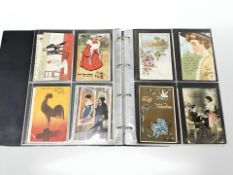 An album containing approximately 176 antique and later greetings cards including Easter, Christmas,