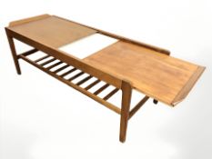 A Remploy teak draw leaf extending coffee table,