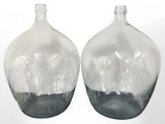 Two glass carbouys,