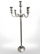 A galvanised polished floor standing candelabrum, height 186 cm.