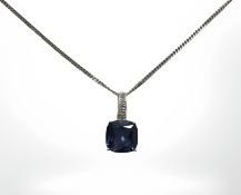 A 9ct white gold synthetic sapphire pendant on 9ct white gold chain, length 46 cm.