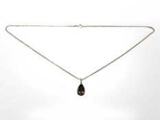 A 9ct yellow gold smokey quartz pendant on 9ct gold chain, length 47 cm.