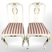 A pair of early 20th century painted and gilt occasional chairs