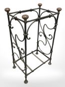A wrought metal umbrella stand,