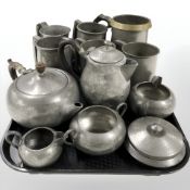 Assorted pewter tankards and tea wares, some with hammered decoration.