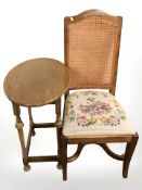 A reproduction oak occasional table and begerre chair
