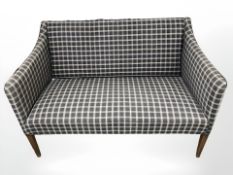 A 20th century two seater salon settee, width 122 cm.