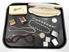 A group of costume jewellery, Churchill Crown, necklaces, small vesta case,