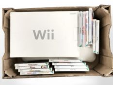 A Nintendo Wii console, Wii Fit board, controllers and various games.
