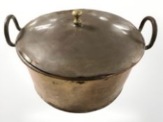 A 19th century copper twin handled cooking pot with lid, diameter 40 cm.