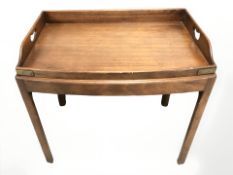 A mahogany bow fronted butler's tray table,