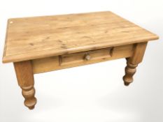 A pine coffee table, fitted a drawer, width 91 cm.