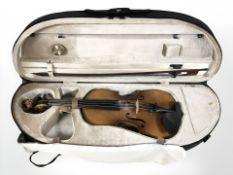 A copy of a Stradivarius violin made in West Germany, labelled to interior, with one piece 14