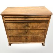 A 19th century Continental burr walnut four drawer chest,