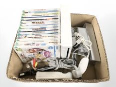 A Nintendo Wii console, controllers and various games.