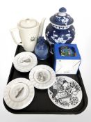 A reproduction Chinese blue and white porcelain temple jar decorated with prunus,