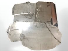 Three Art Deco frameless mirrors, largest 65 cm.