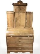 A 19th century oak cylinder fronted secretaire bookcase,