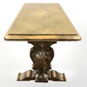 A continental carved oak refectory coffee table, each end carved with warriors, length 114 cm.