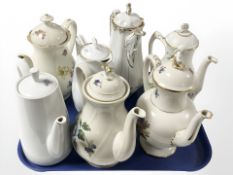 Seven various continental porcelain tea pots.