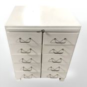 A mid 20th century painted ten drawer chest,